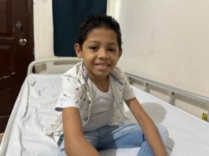Boy on hospital bed